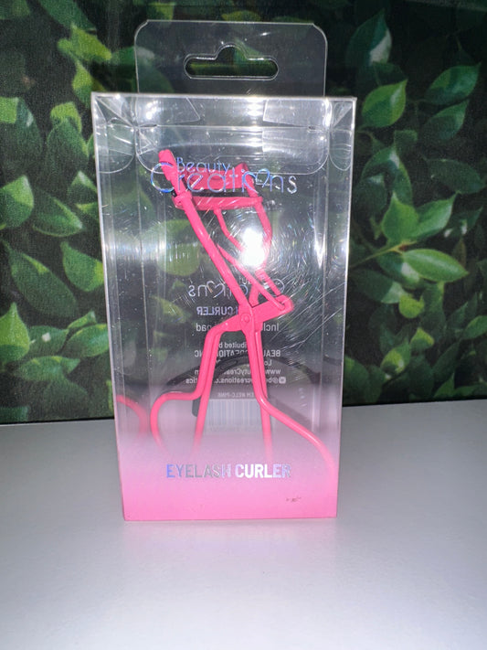 Pink eyelash curler